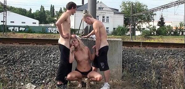  2 young friends met an older woman on the street and fucked her in public with a sensual oral sex deep throat blowjob action and vaginal sex intercourse fucking her pussy in turn and pounding her cunt hard at railway station for random strangers to watch